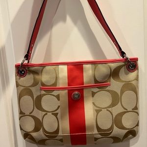 Coach purse! 100 percent authentic. Coral and tan. No exterior marks.